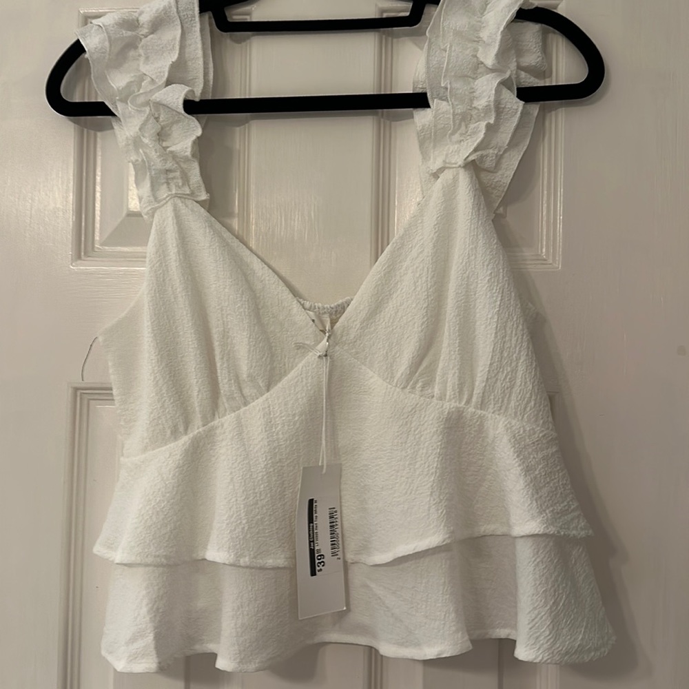 White top. Size medium. Never worn.
